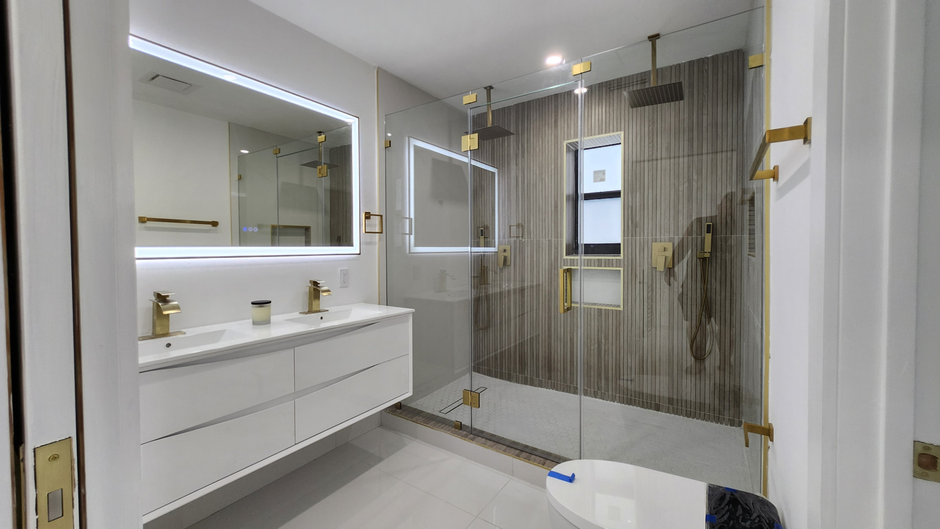 Finished bathroom remodel with a walk-in tile shower and floating vanity